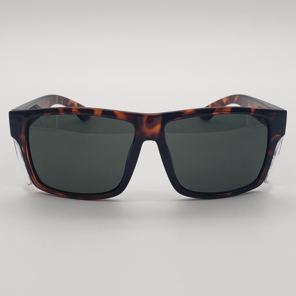 A pair of square sunglasses with a dark brown and black tortoiseshell frame and dark gray lenses, shown against a neutral light gray background.