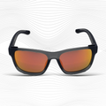 Sunglasses with black frame and orange-red lenses on a white background